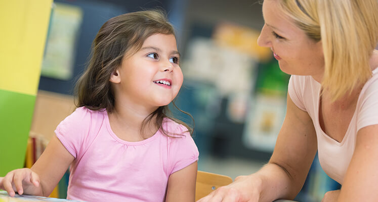 Mum talking to young girl